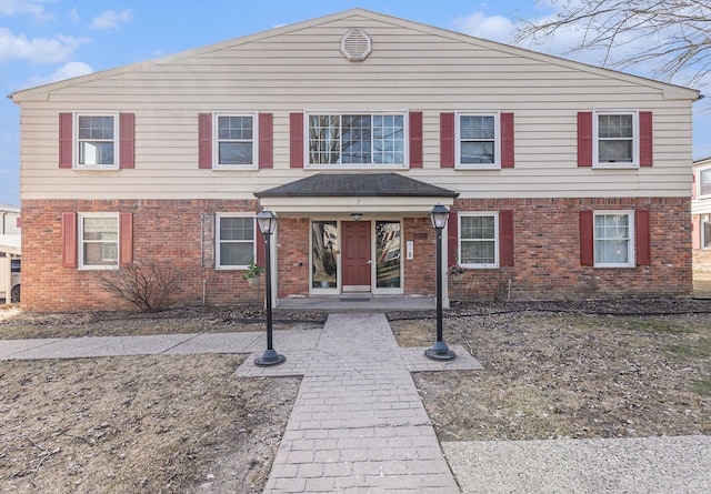 view of front of home with brick siding