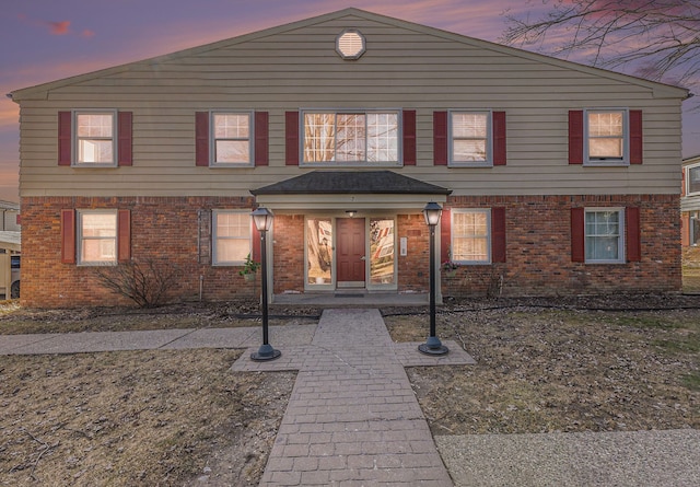 view of front facade featuring brick siding