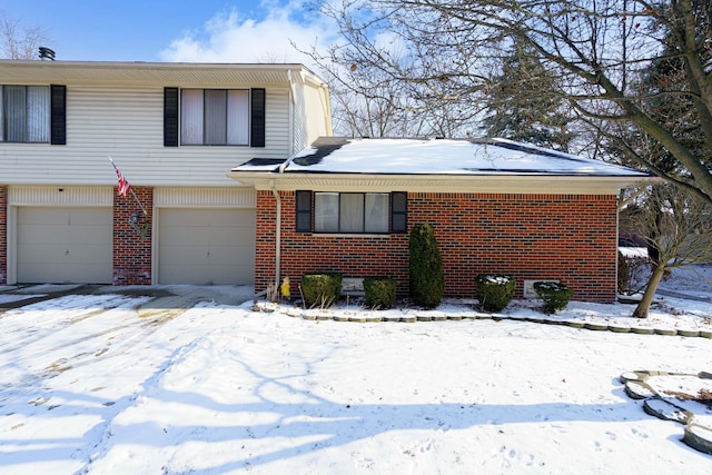 view of front of house with brick siding and an attached garage