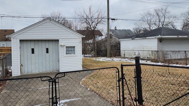 view of yard featuring a garage, an outdoor structure, and fence