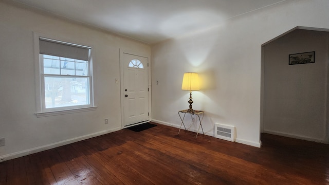 entrance foyer with visible vents, baseboards, and hardwood / wood-style flooring