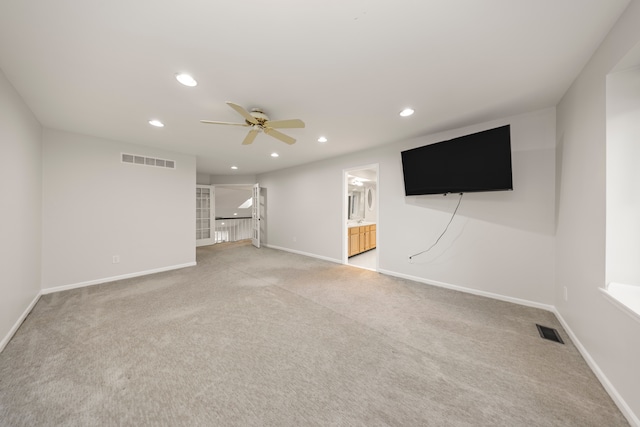 unfurnished living room with baseboards, visible vents, and recessed lighting