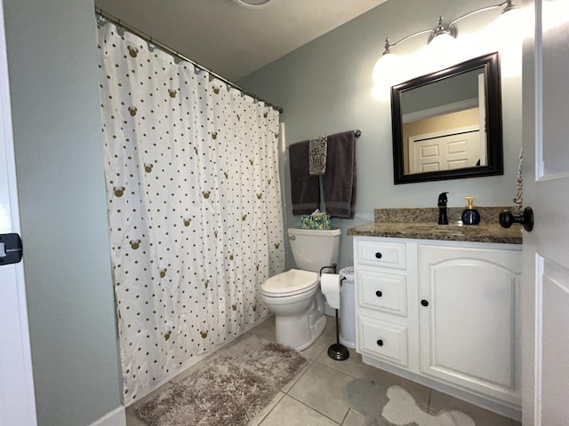 full bath featuring a shower with curtain, vanity, toilet, and tile patterned floors