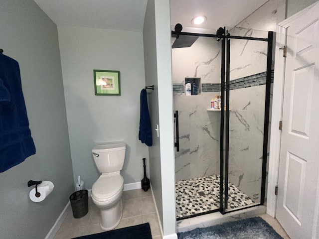 full bath with toilet, a marble finish shower, baseboards, and tile patterned floors