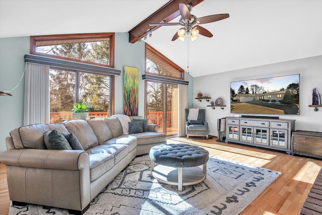 living room featuring high vaulted ceiling, wood finished floors, beam ceiling, and a ceiling fan