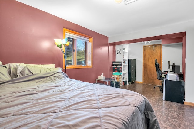 bedroom featuring baseboards