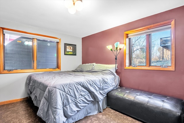 carpeted bedroom with baseboards