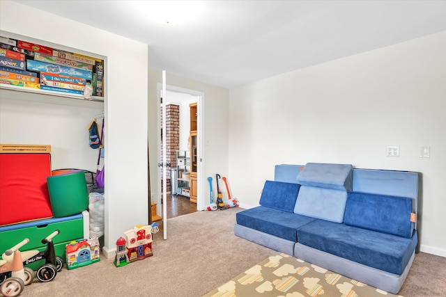 playroom with baseboards and carpet flooring