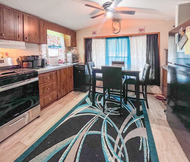 kitchen featuring brown cabinets, black appliances, ventilation hood, and light wood finished floors