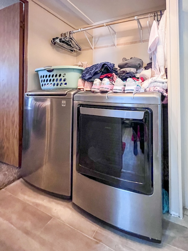 laundry area with laundry area and separate washer and dryer