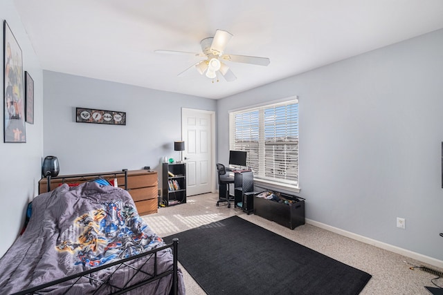 bedroom with ceiling fan, baseboards, and carpet flooring