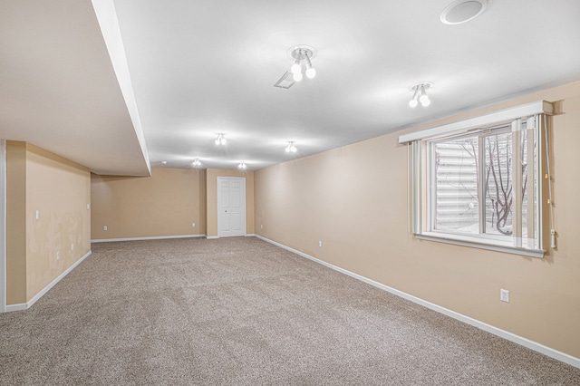 below grade area with carpet flooring and baseboards