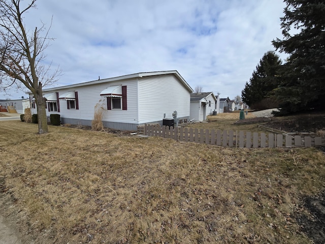 view of home's exterior featuring a lawn