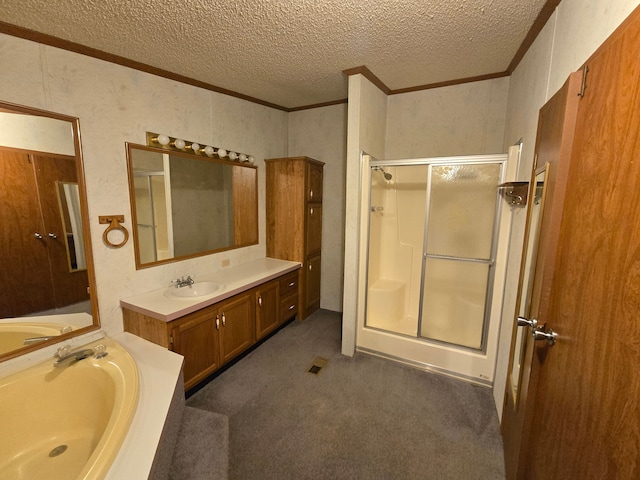 bathroom with ornamental molding, a garden tub, a shower stall, and a textured ceiling