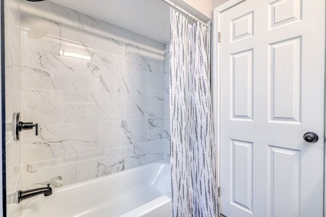 full bath featuring shower / tub combo with curtain