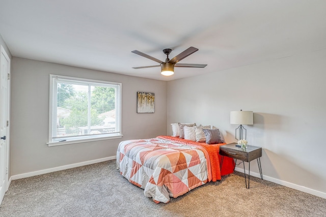 bedroom featuring carpet, baseboards, and a ceiling fan