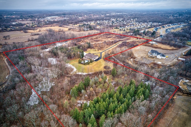 birds eye view of property with a rural view