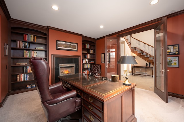 carpeted home office featuring recessed lighting, french doors, crown molding, and a tiled fireplace