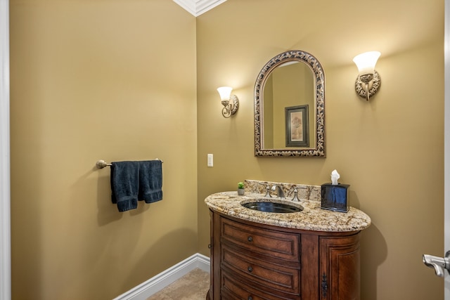 bathroom featuring baseboards and vanity