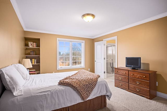 carpeted bedroom featuring crown molding, baseboards, and ensuite bathroom