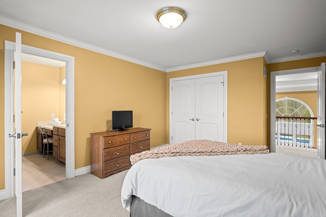 bedroom with a closet, light colored carpet, crown molding, and baseboards