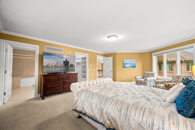 bedroom featuring visible vents, light colored carpet, ensuite bath, ornamental molding, and a spacious closet