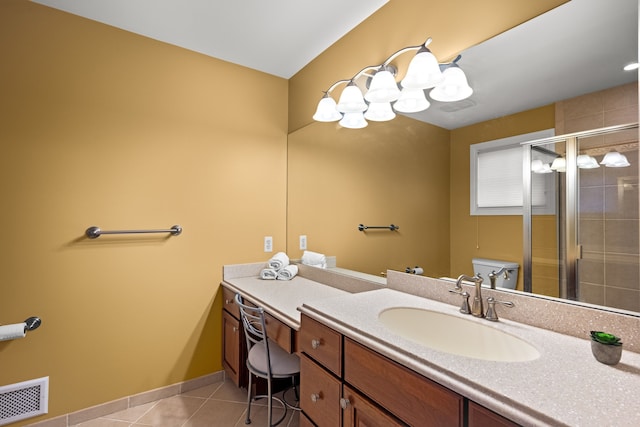 bathroom with visible vents, toilet, a shower stall, vanity, and tile patterned floors