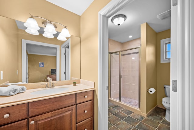 bathroom with a notable chandelier, toilet, a stall shower, vanity, and tile patterned flooring