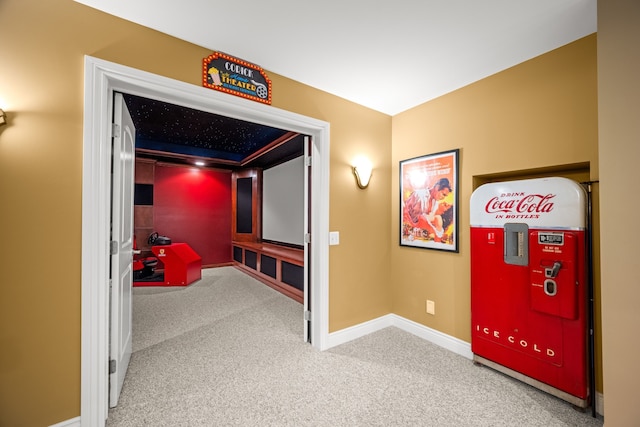 cinema room with carpet floors and baseboards