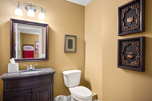 bathroom with toilet and vanity