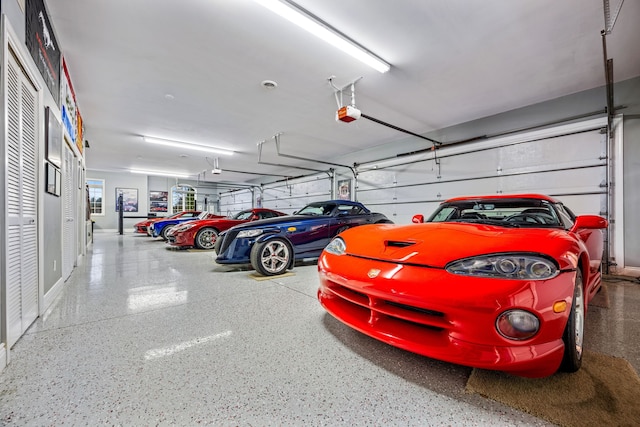 parking garage featuring a garage door opener