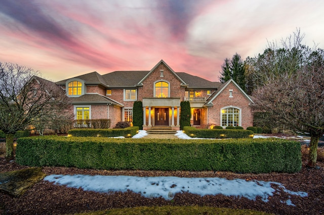 georgian-style home with brick siding