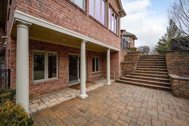 view of patio / terrace featuring stairs