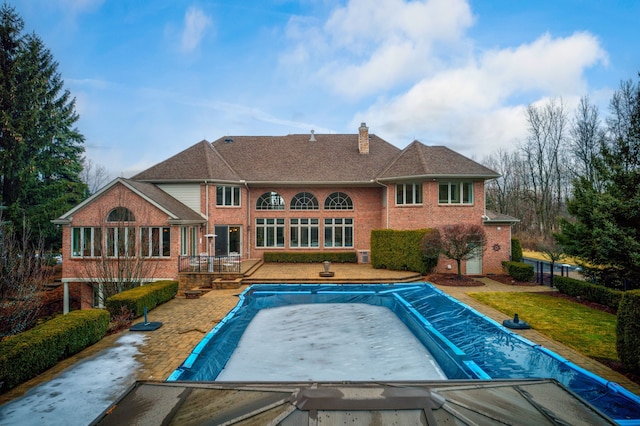 view of pool with a patio area and a covered pool