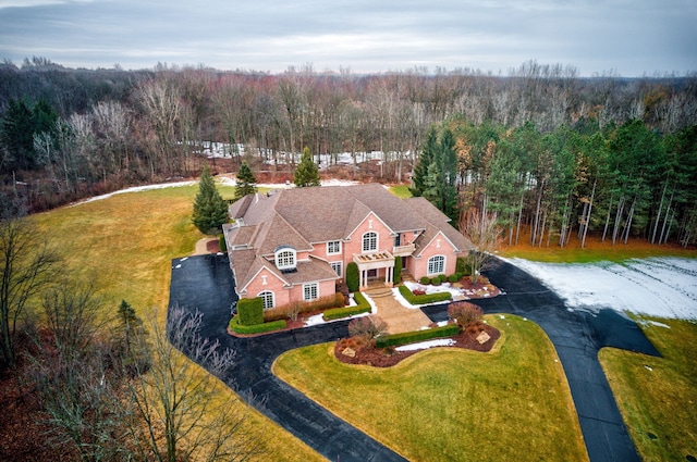 bird's eye view featuring a wooded view