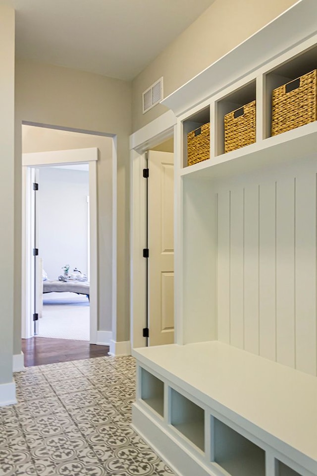 mudroom featuring visible vents and baseboards