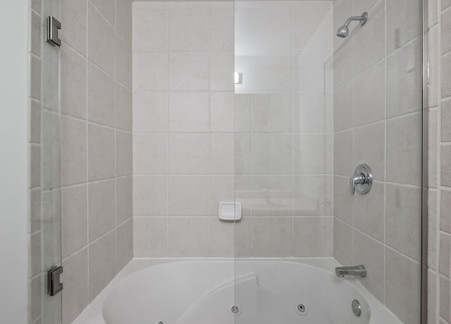 full bathroom featuring a combined bath / shower with jetted tub