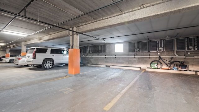 parking deck featuring concrete block wall