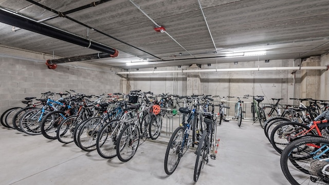 garage featuring concrete block wall and bike storage