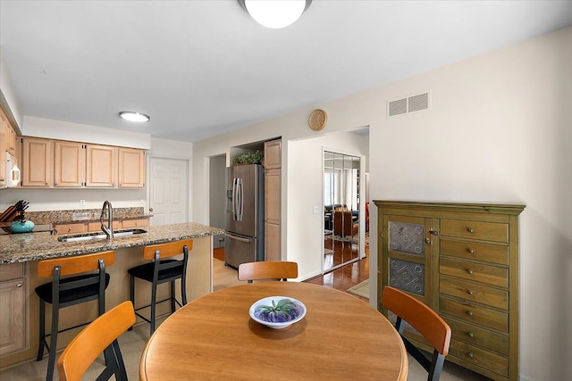 dining room featuring visible vents