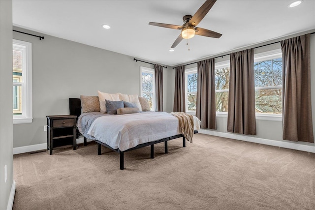 bedroom featuring baseboards, recessed lighting, a ceiling fan, and light colored carpet