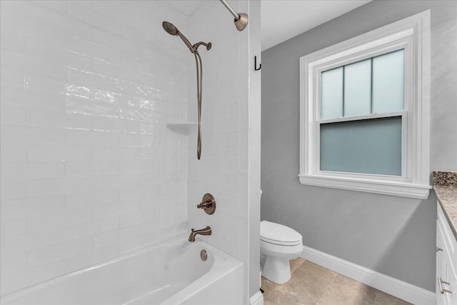 full bathroom with tile patterned flooring, toilet, vanity, baseboards, and shower / washtub combination