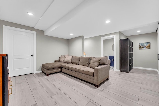 living area with recessed lighting, baseboards, and wood finish floors