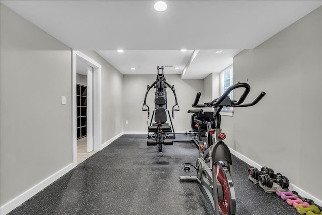 exercise area featuring recessed lighting and baseboards