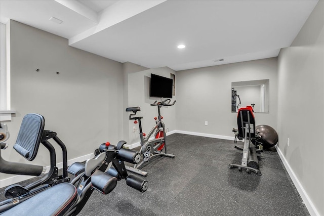 exercise area featuring recessed lighting, visible vents, and baseboards