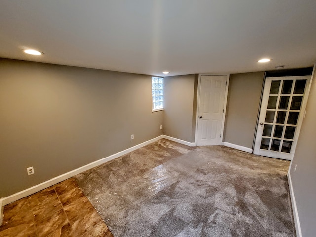 basement featuring recessed lighting and baseboards