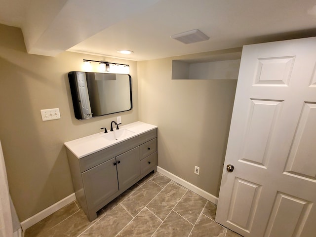 bathroom featuring vanity and baseboards