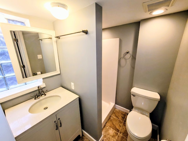 bathroom with a stall shower, baseboards, visible vents, toilet, and vanity