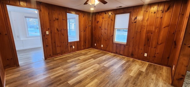 empty room featuring ceiling fan and wood finished floors