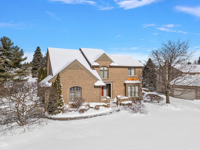 traditional-style home featuring brick siding